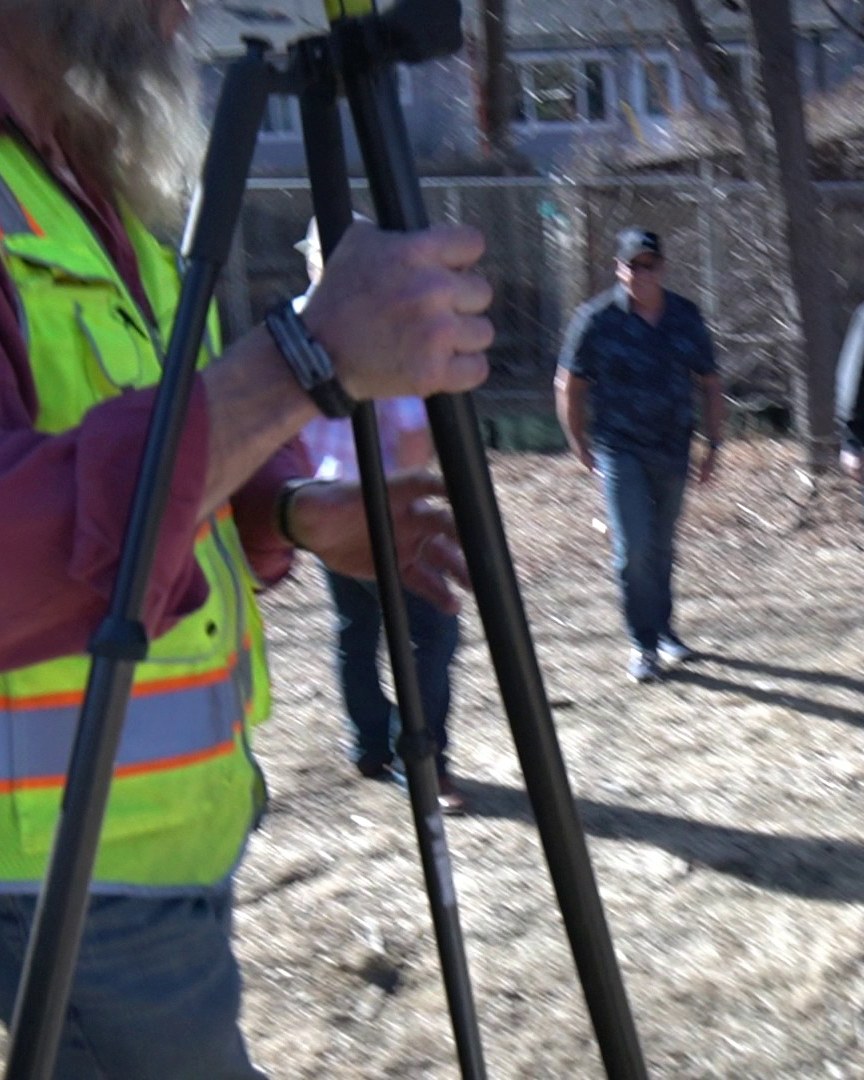 Instructor teaching at a tripod